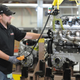 An Engine Builder weighing a completed Camaro Z/28 LS7 engine in the Performance Build Center Wednesday, October 22, 2014 at the plant in Bowling Green, Kentucky.